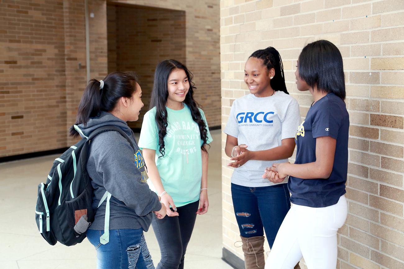 Students talk in a hallway