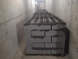 Cinder blocks stacked in a hallway.