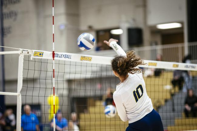 Braelyn Berry hits the volleyball over the net.