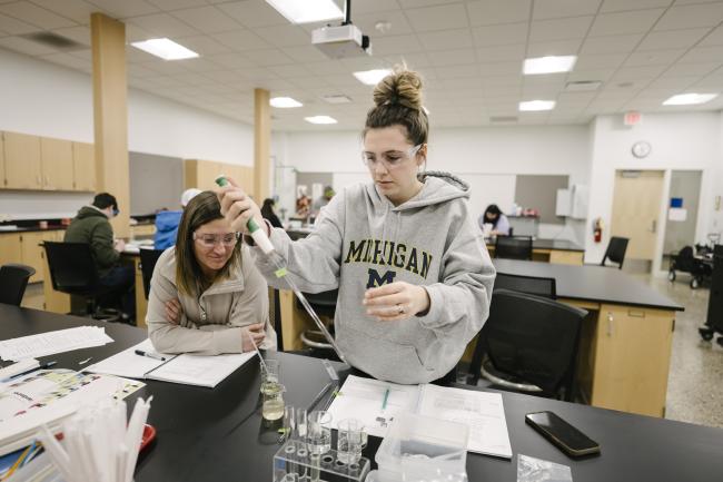 Student wearing a University of Michigan sweatshirt in a GRCC bio class. 