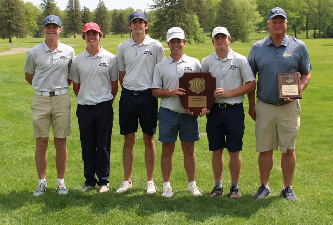 GRCC golf team posing with its trophies.