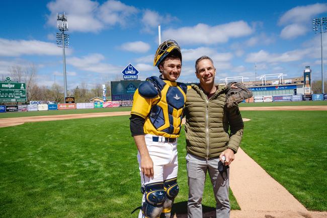 Dino Paganelli poses with his son before throwing out the ceremonial first pitch at LMCU Ballpark.