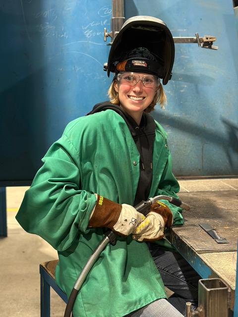 GRCC welding instructor Brianna Lampe-Sedgwick poses in her welding gear.