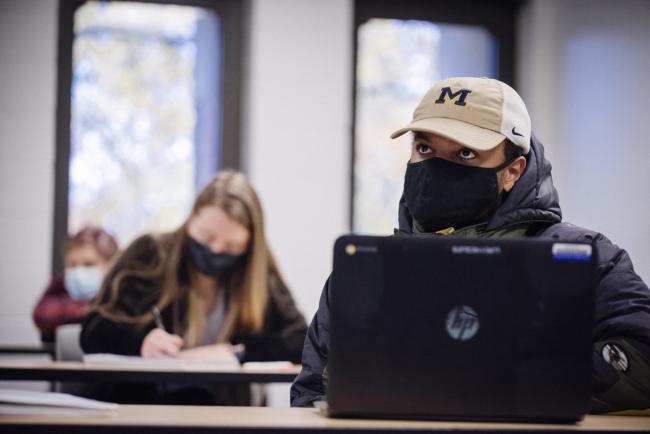 GRCC psychology student wearing a University of Michigan cap. 