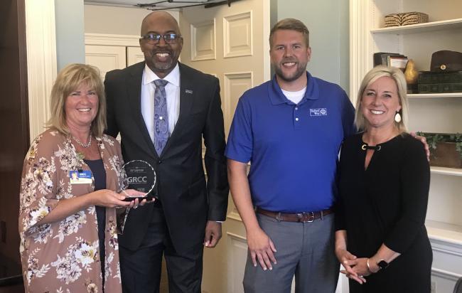 United Way Vice President Kim Ritz and account executive Scott Sorenson presented President Bill Pink and Misty McClure Anderson, executive deputy to the president and board liaison, with the 2020 United Way Top Campaign Award.