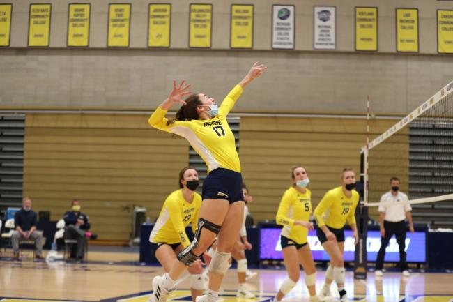 GRCC volleyball player jumping up for a spike.
