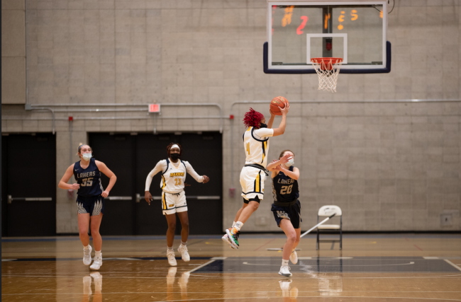 GRCC women's basketball player Shonyah Hawkins jumps to make a shot.
