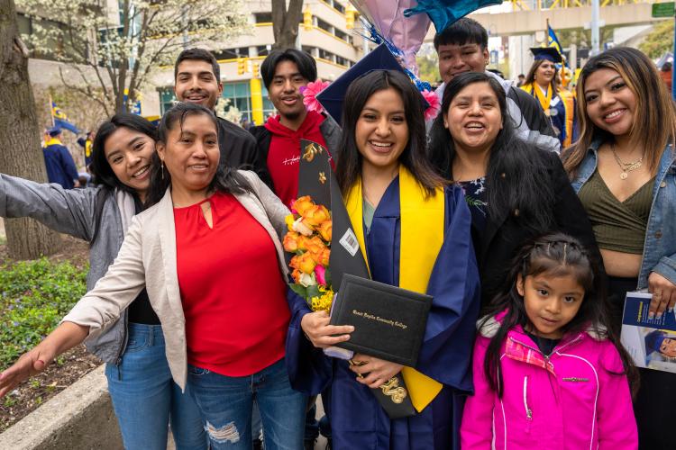 A proud family posing with a graduate!