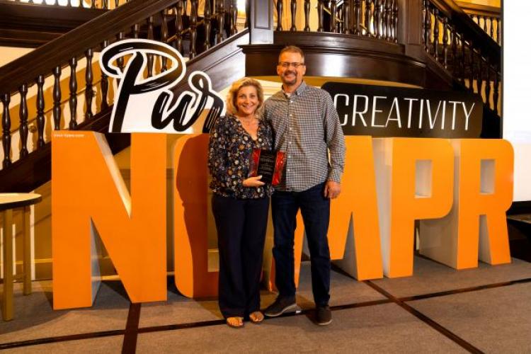 Elly Bainbridge with her husband, Scott, accepting her award.