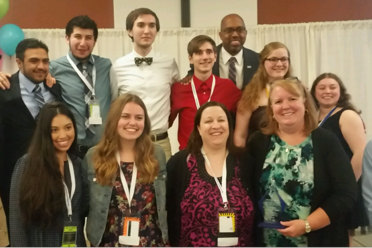 Phi Theta Kappa members stand with President Pink and advisers Erin Busscher and Lynnae Selberg.