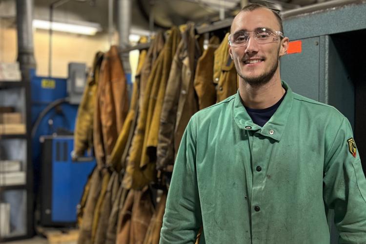 Portrait of Aaron Smalley in the welding lab.