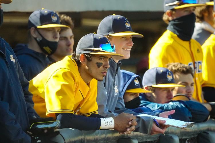 Baseball players in the dugout.