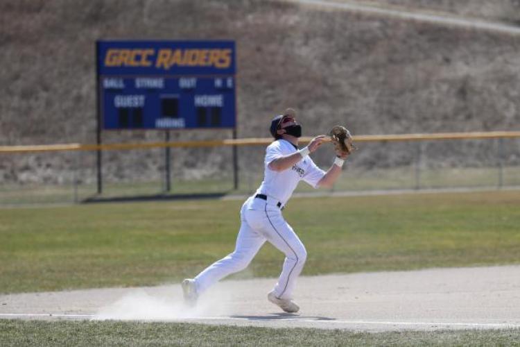 GRCC infielder looking up to make a catch.