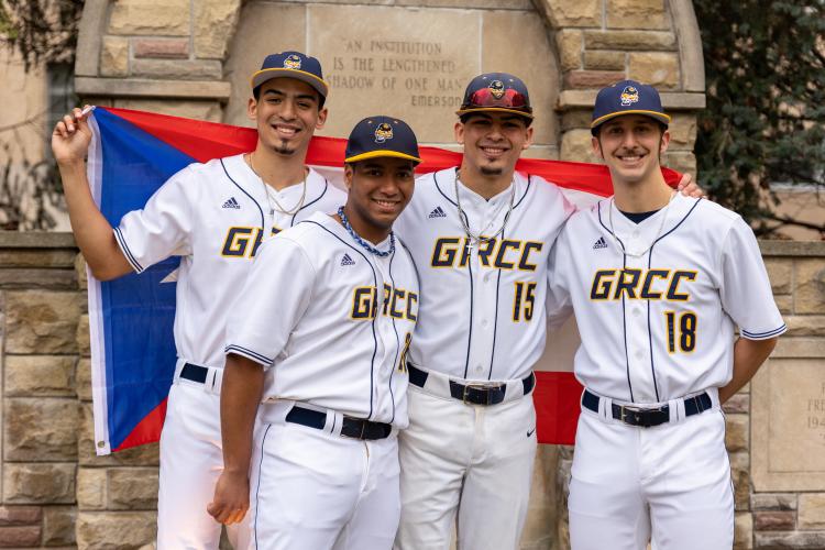 Baseball players posing near the iconic Lion Fountain.