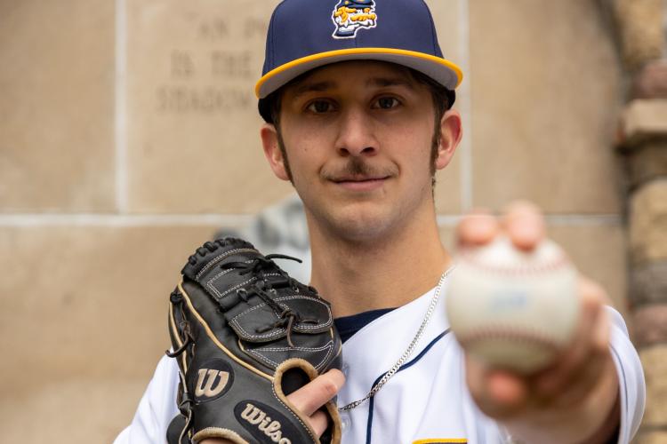 Blake Weibel posing with a ball.