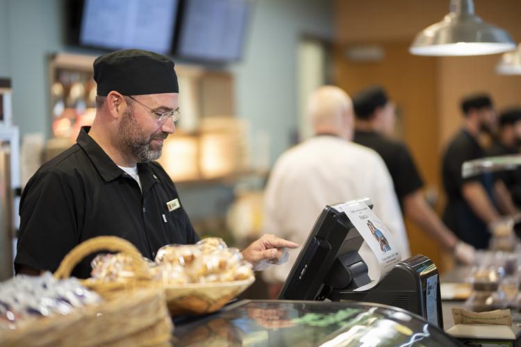 Brad Verberg works the cash register at Art and Bev's.