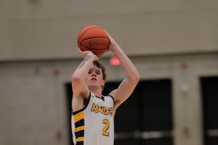 Brock Kohler shooting a fgree throw.