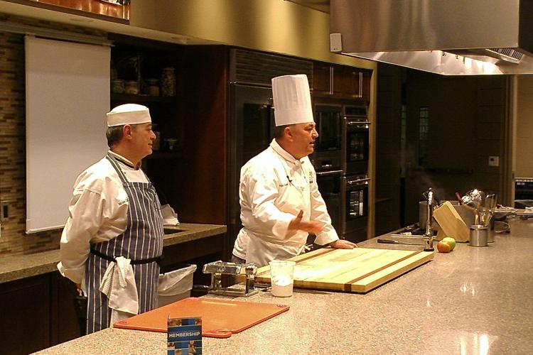 Chefs Nicola Conte and Angus Campbell working with GRCC students.