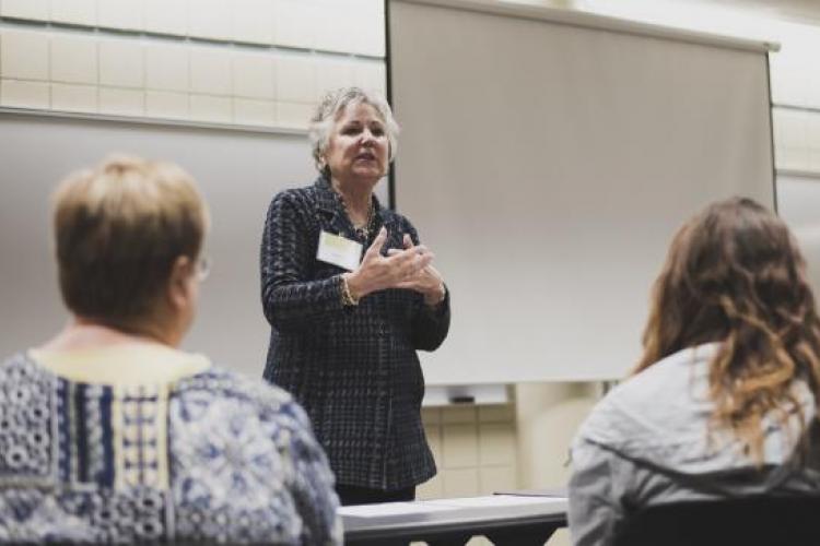 Former trustee Deb Bailey leading an discussion.