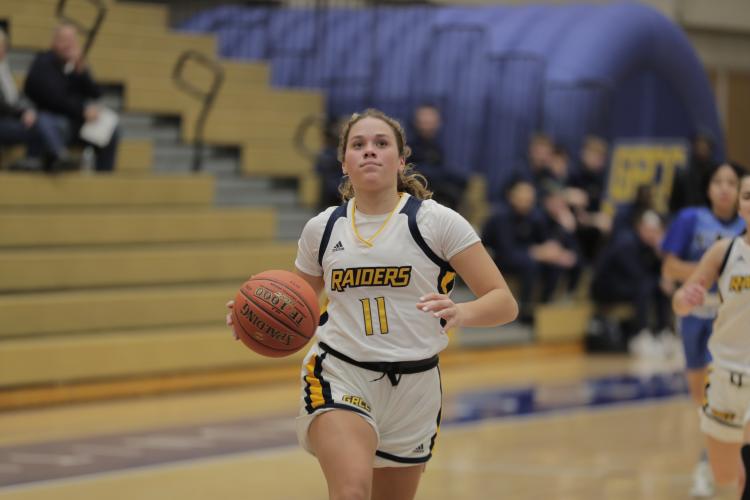 Emersyn Kopke driving down the court.