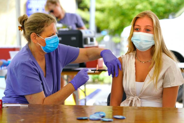 A student receiving a vaccination at Raider Rally.