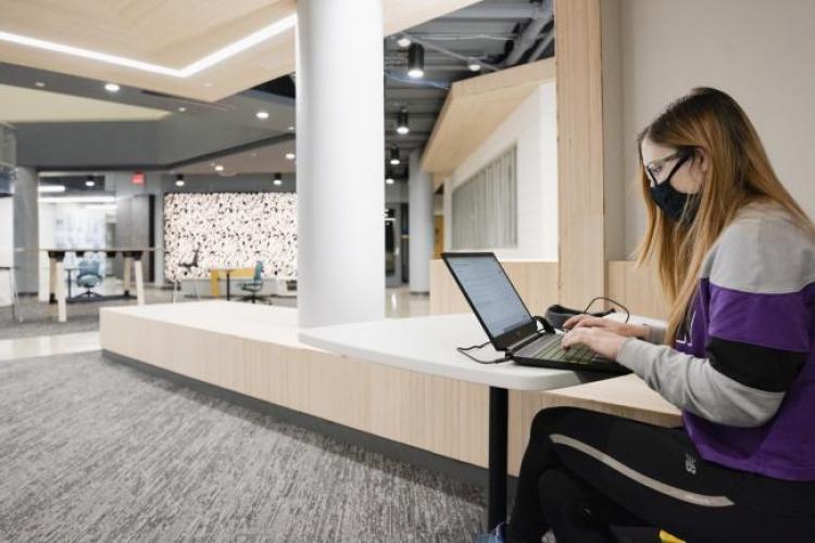 Student working on a laptop in the newly renovated ATC