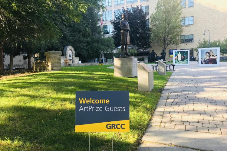 Signs welcoming ArtPrize guests on the Olivarez Student Plaza in 2021.