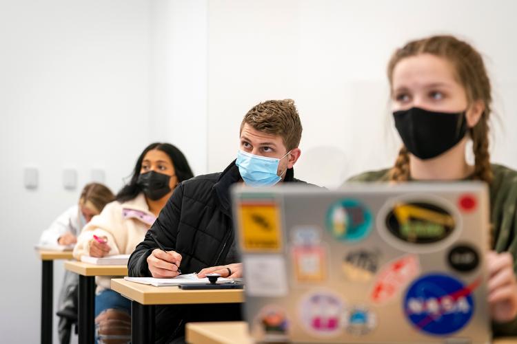 Students working in a business class.