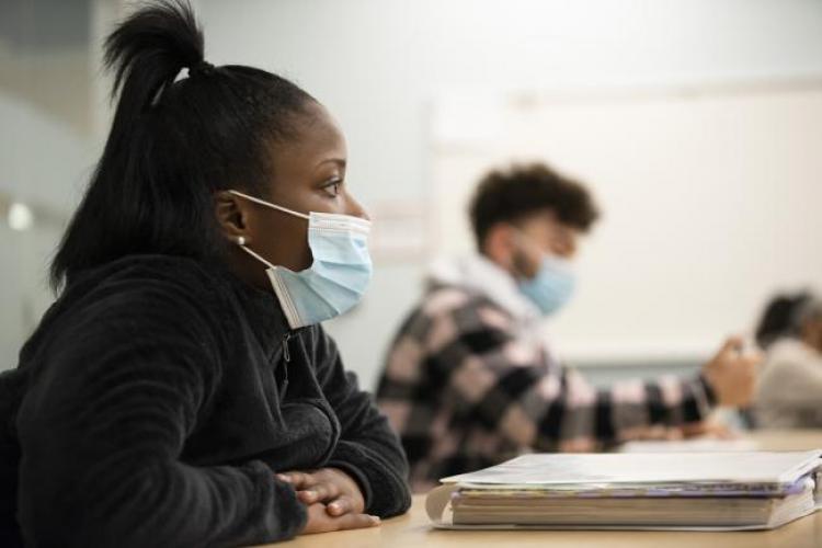 Students in a classroom wearing masks.