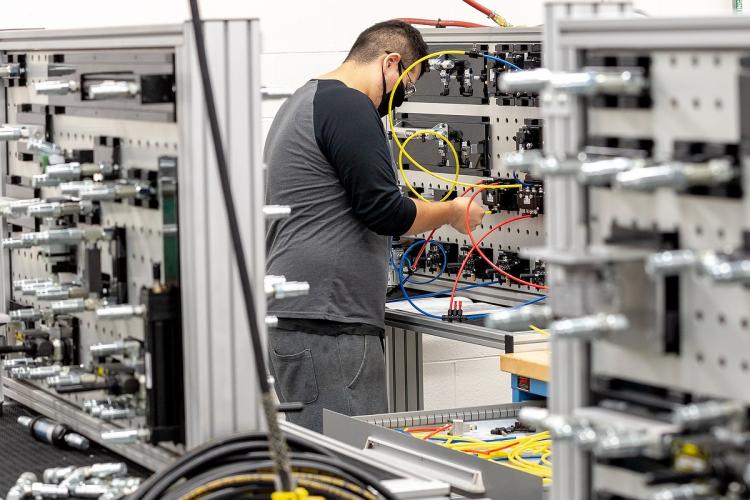 GRCC student working in a manufacturing pneumatics class