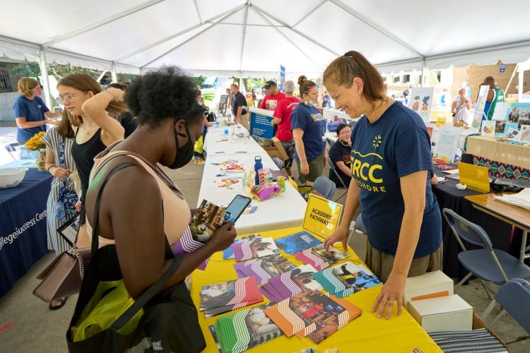 A GRCC student learning about Academic Pathways at Raider Rally.