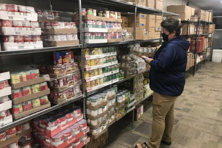 Lina Blair restocking the GRCC Food Pantry