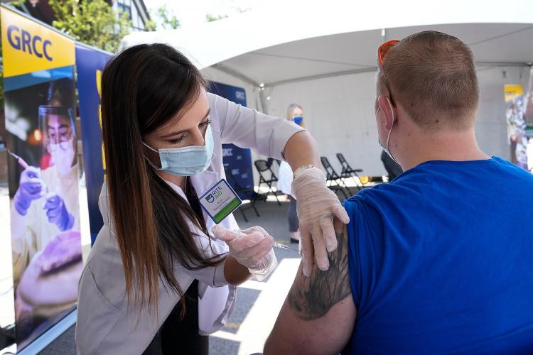 Student getting a vaccination at a GRCC clinic.