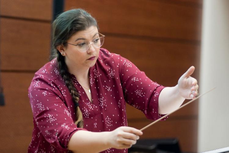 Music director Shannon Shaker conducting during class.