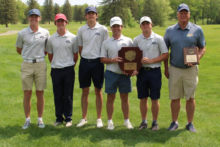 GRCC golf team posing with its trophies.