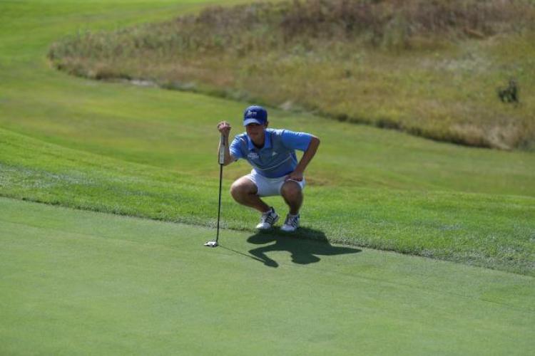 GRCC golfer lining up a putt.