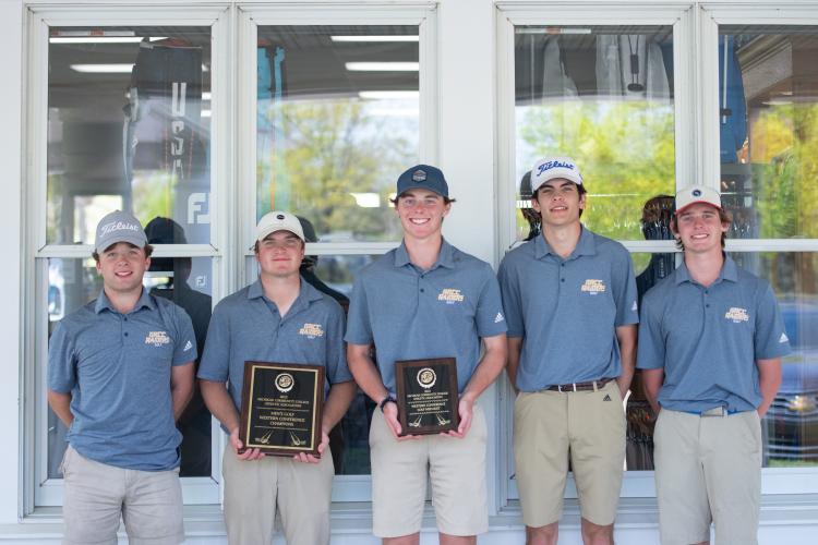 GRCC golf team holding awards after the NJCAA Region XII tournament.