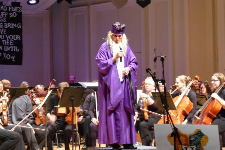 Libor Ondras, dressed as Dumbledore, conducts the Kent Philharmonic Orchestra.