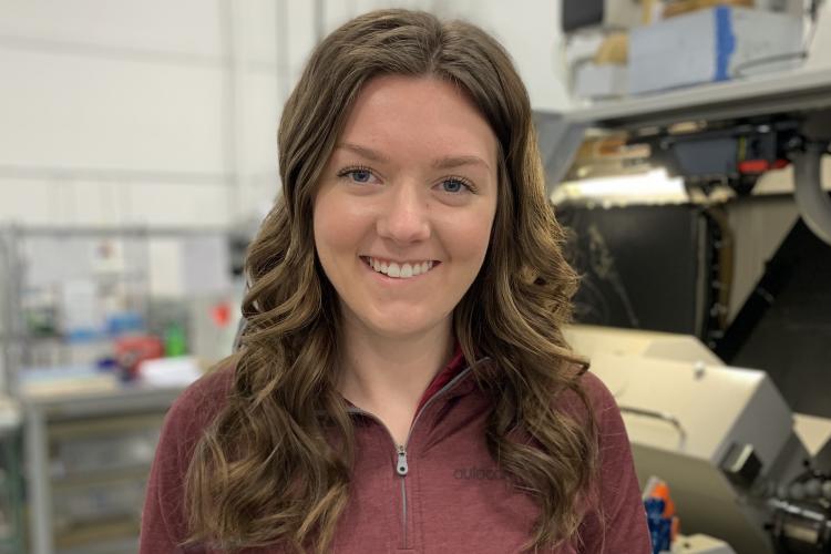 Portrait of Madelynn Pohl in the machining shop.