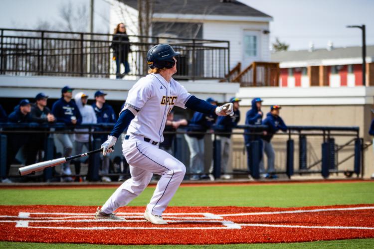 Ryan Dykstra starting to run after hitting the ball.