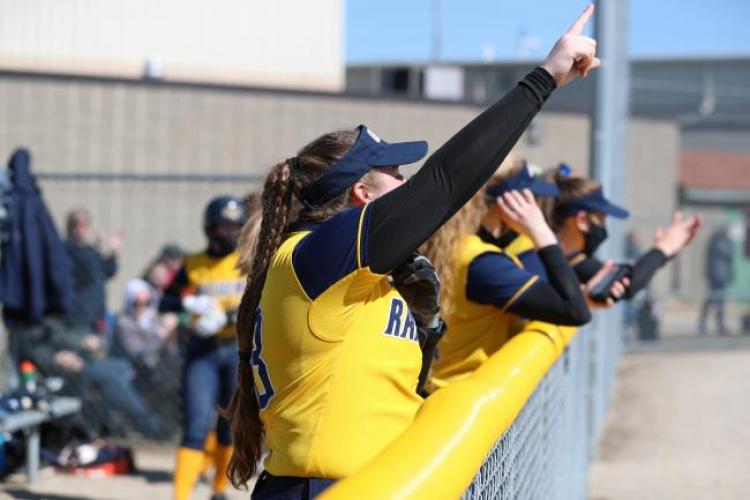 GRCC softball players celebrating.