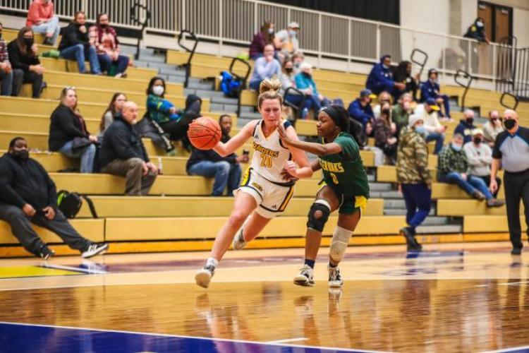 Sally Merrill driving to the basket.