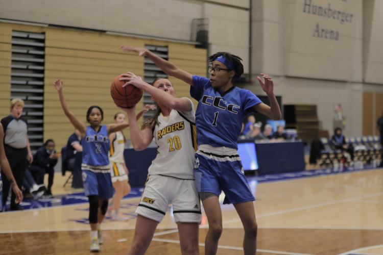 Sally Merrill trying to shoot around a defender.