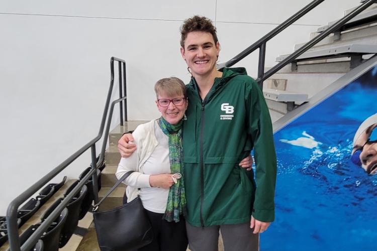 Sara Anne Hook and Eric at a swim meet.