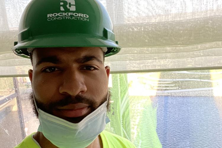 Shammer Martin in his hard hat at a job site.