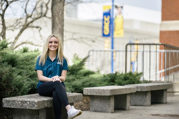 Sherry Sokolowski sitting on a bench on campus.