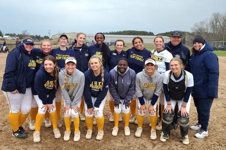 The softball team posing in Escanaba.