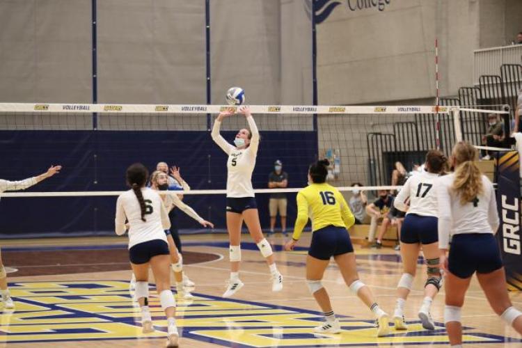 Volleyball player placing a set for a spike.