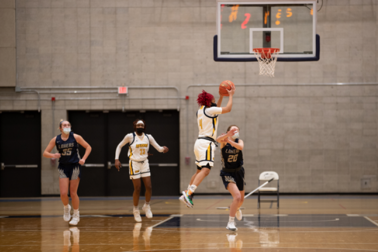 GRCC women's basketball player Shonyah Hawkins jumps to make a shot.