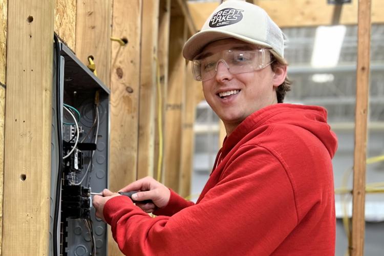 Ben Mast working on an electrical box.